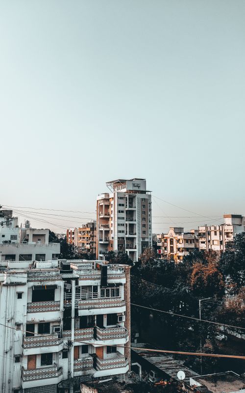 Free Aerial view of urban apartment buildings with a clear sky, showcasing modern architecture. Stock Photo