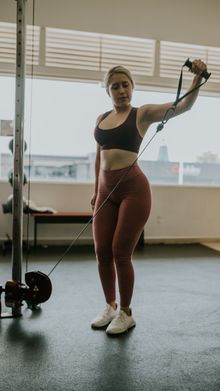 Athlete pulling a cable handle in a gym, photo by Amar Preciado on Pexels