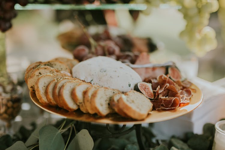 Sliced Bread And Cheese On Brass Tray