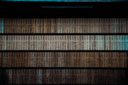 Close-up of wooden plaques with kanji script at a Japanese shrine, showcasing traditional design.