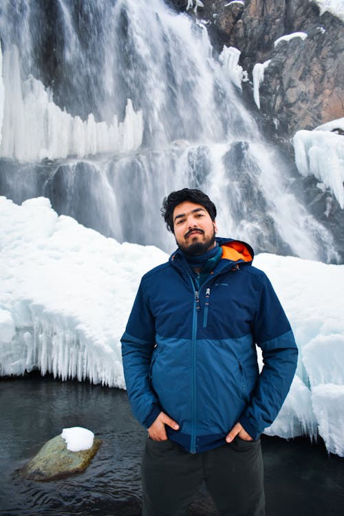 A Man in Blue Jacket Smiling at the Camera