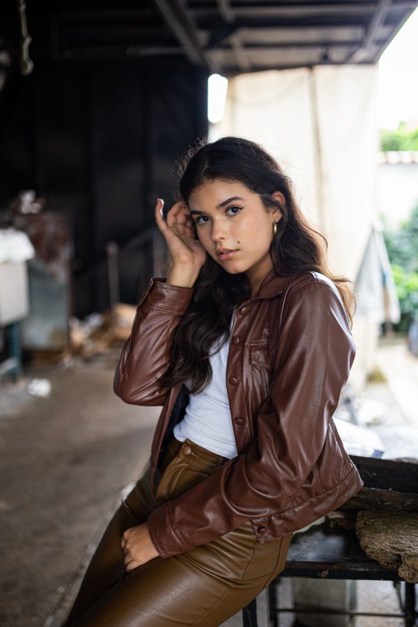Brown leather top with barrel jeans