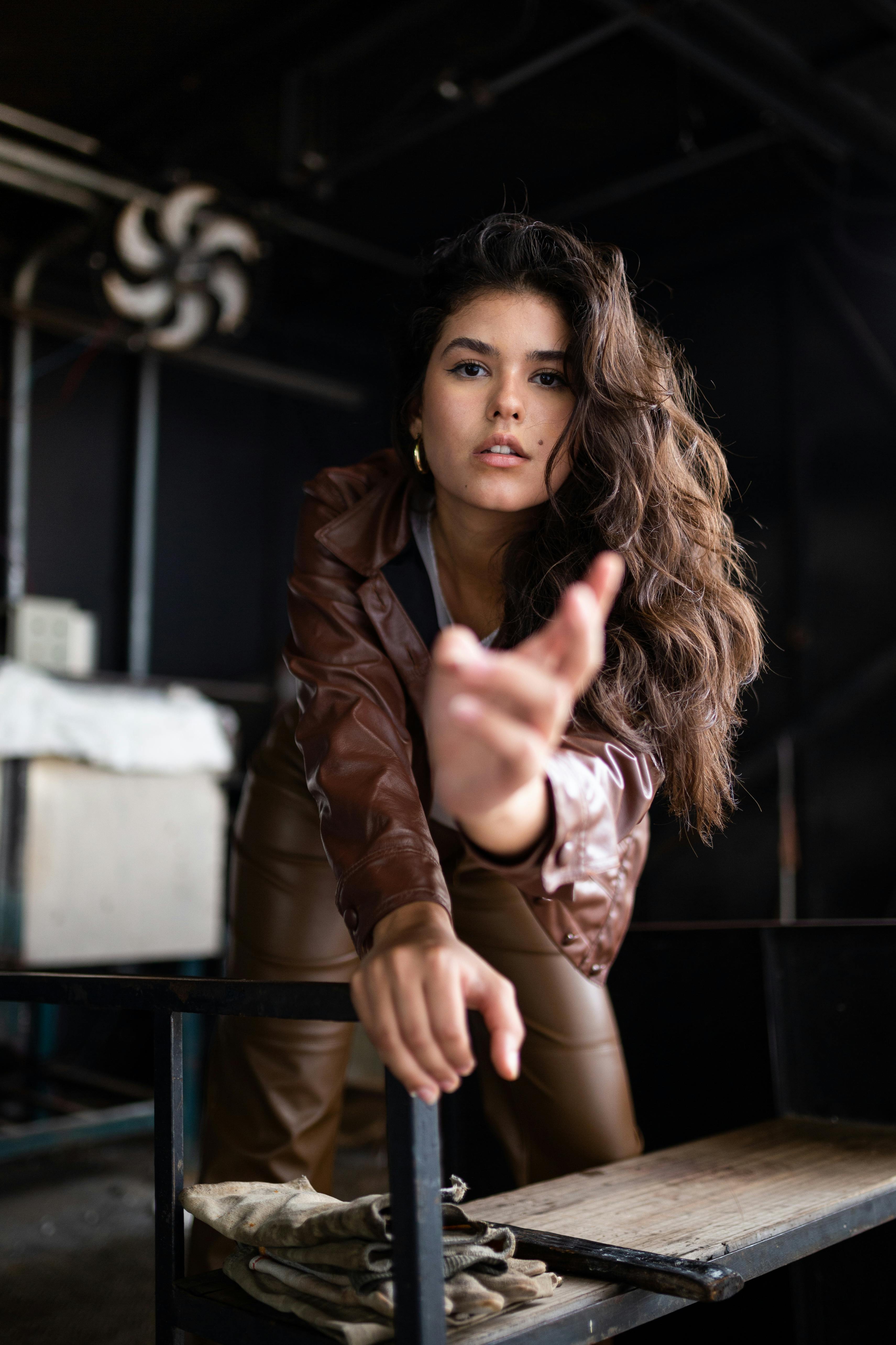 woman poses posing leather jacket young younger layer casual youthful Stock  Photo - Alamy