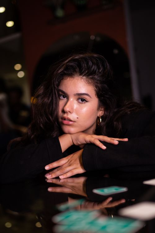 Free Captivating portrait of a young woman in São Paulo, featuring stylish fashion and a moody atmosphere. Stock Photo