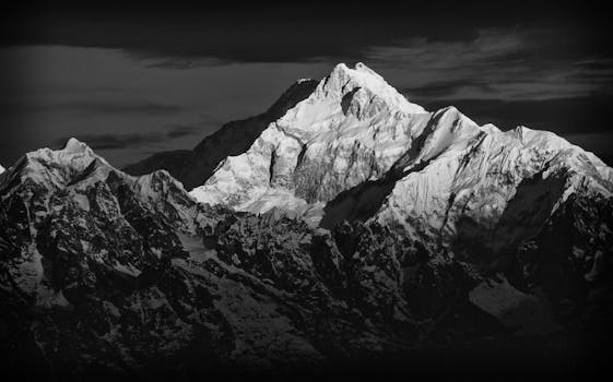Stunning black and white photograph of snow-capped Kanchenjunga from Darjeeling, India.