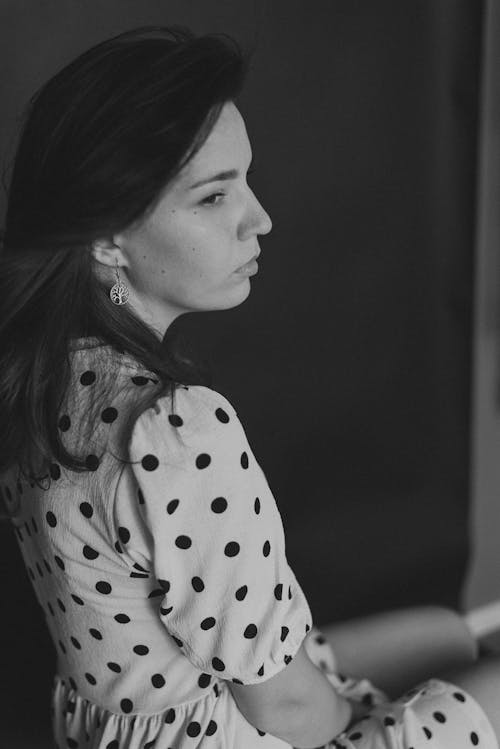 Grayscale Photo of a Woman Wearing Polka Dots Dress