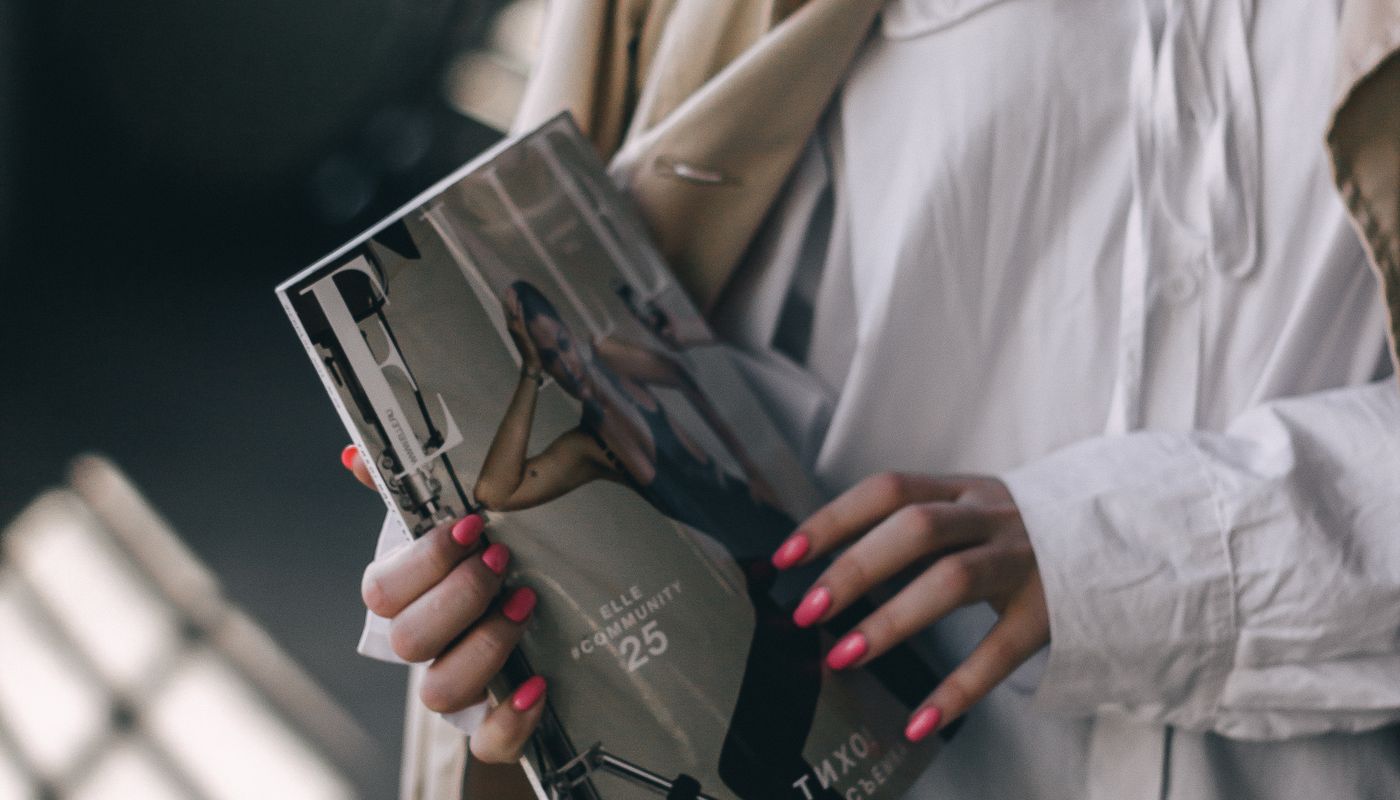 keep new year resolutions — Woman Holding Fitness Magazine · Free. Photo: Pexels