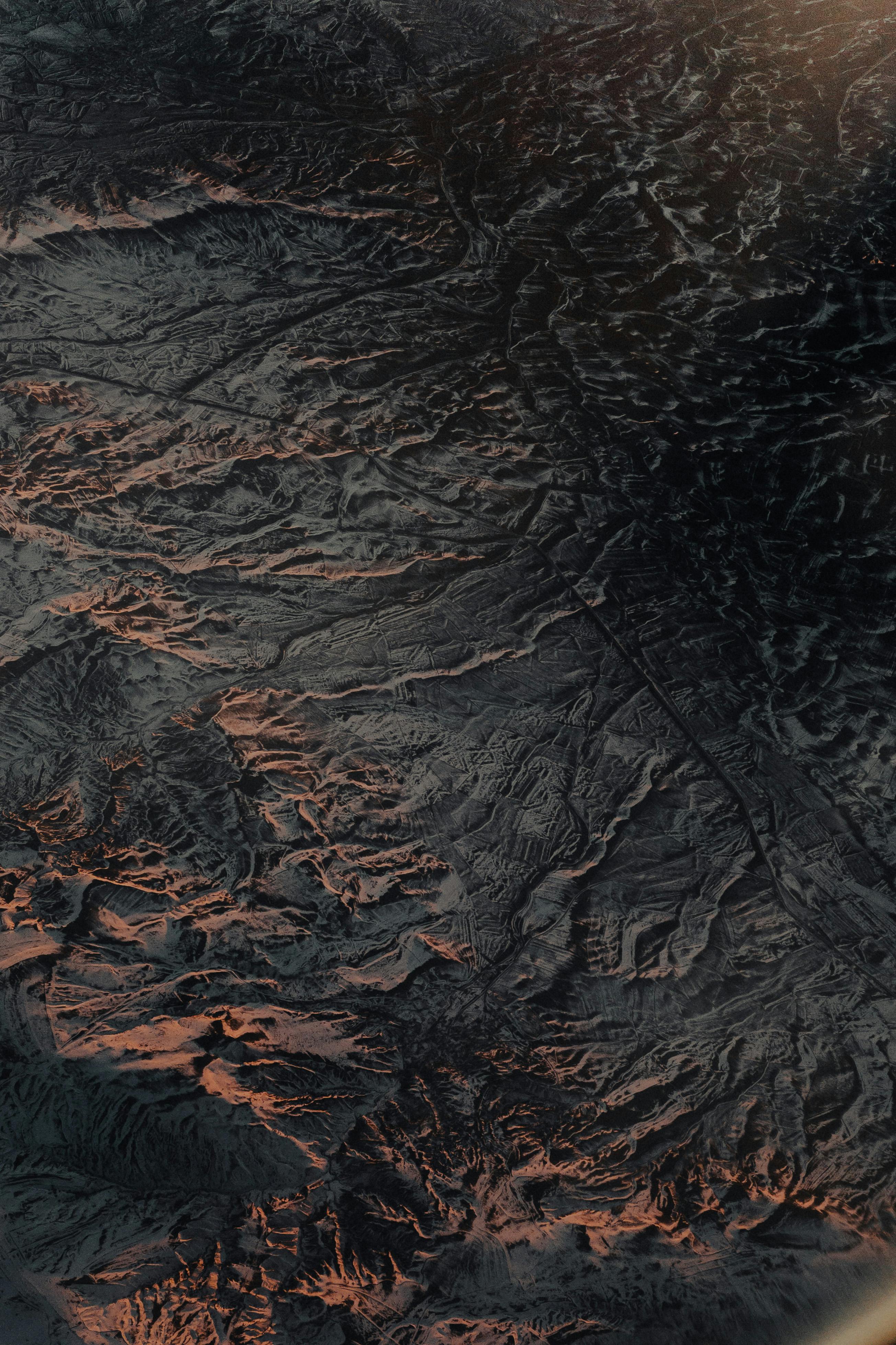 Stunning aerial perspective of rugged Turkish landscape with deep textures and twilight hues.