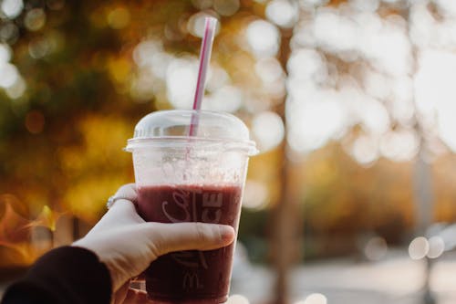 Person Holding Plastic Cup