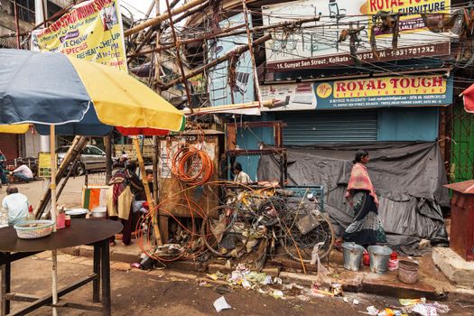 Vibrant street scene in Kolkata showcasing market stalls and urban street life.