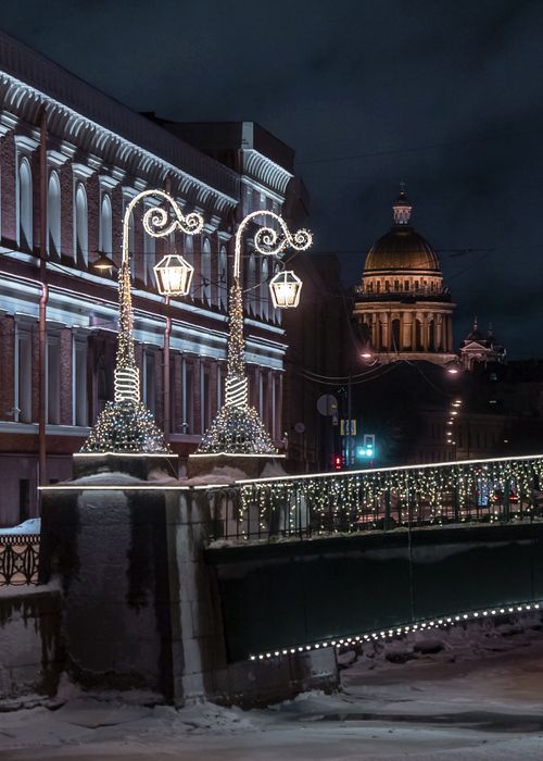 Free St. Petersburg's winter night scene with festive lights and historical architecture. Stock Photo