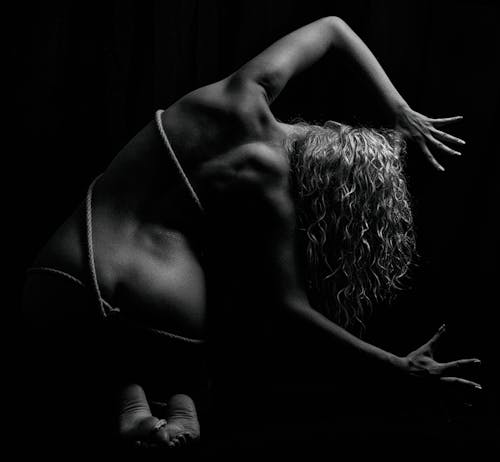 Black and White Photo of a Woman with Rope on Body