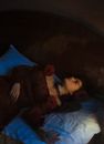 Woman in Evening Gown Lying on Mattress