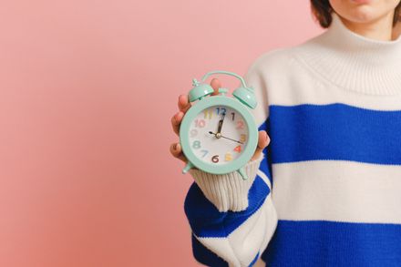 Person holding an alarm clock — Anna Shvets on Pexels