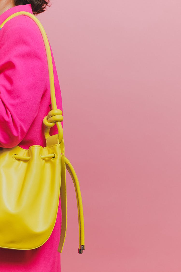 A Person Carrying A Yellow Shoulder Bag