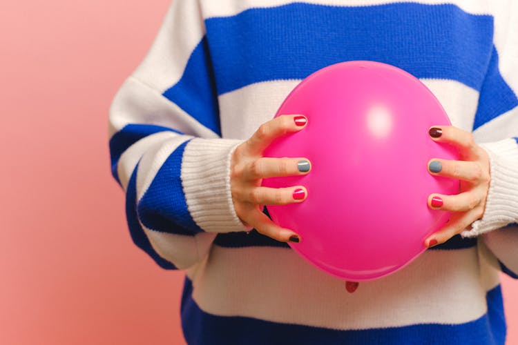 Close-up Of Holding A Pink Balloon