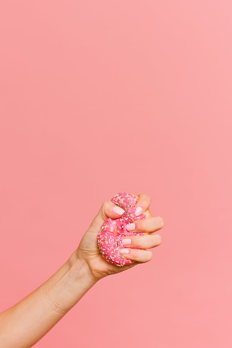 Person Squeezing Donut