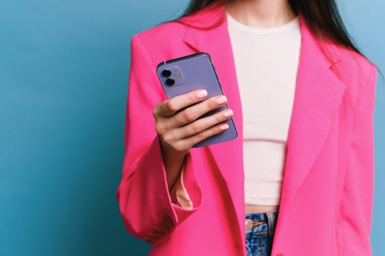 A Woman Holding A Cell Phone