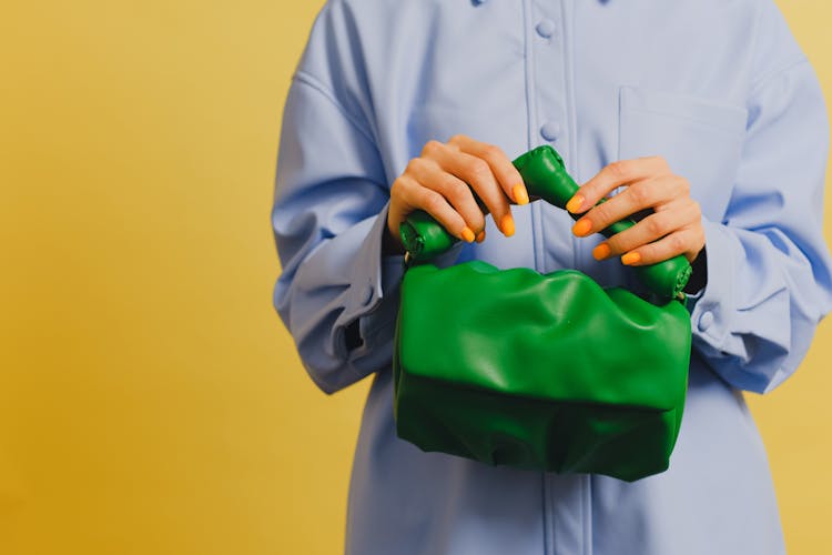 Woman Holding A Green Bag