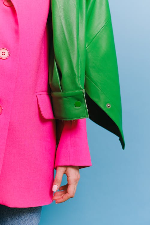Woman Wearing Pink Blazer and Green Jacket