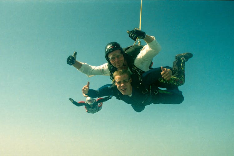Men Parachuting In The Sky