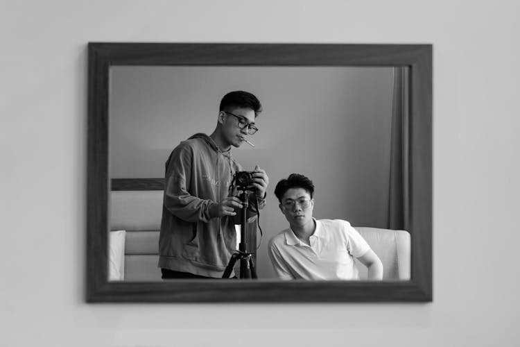 Man With Camera In Mirror