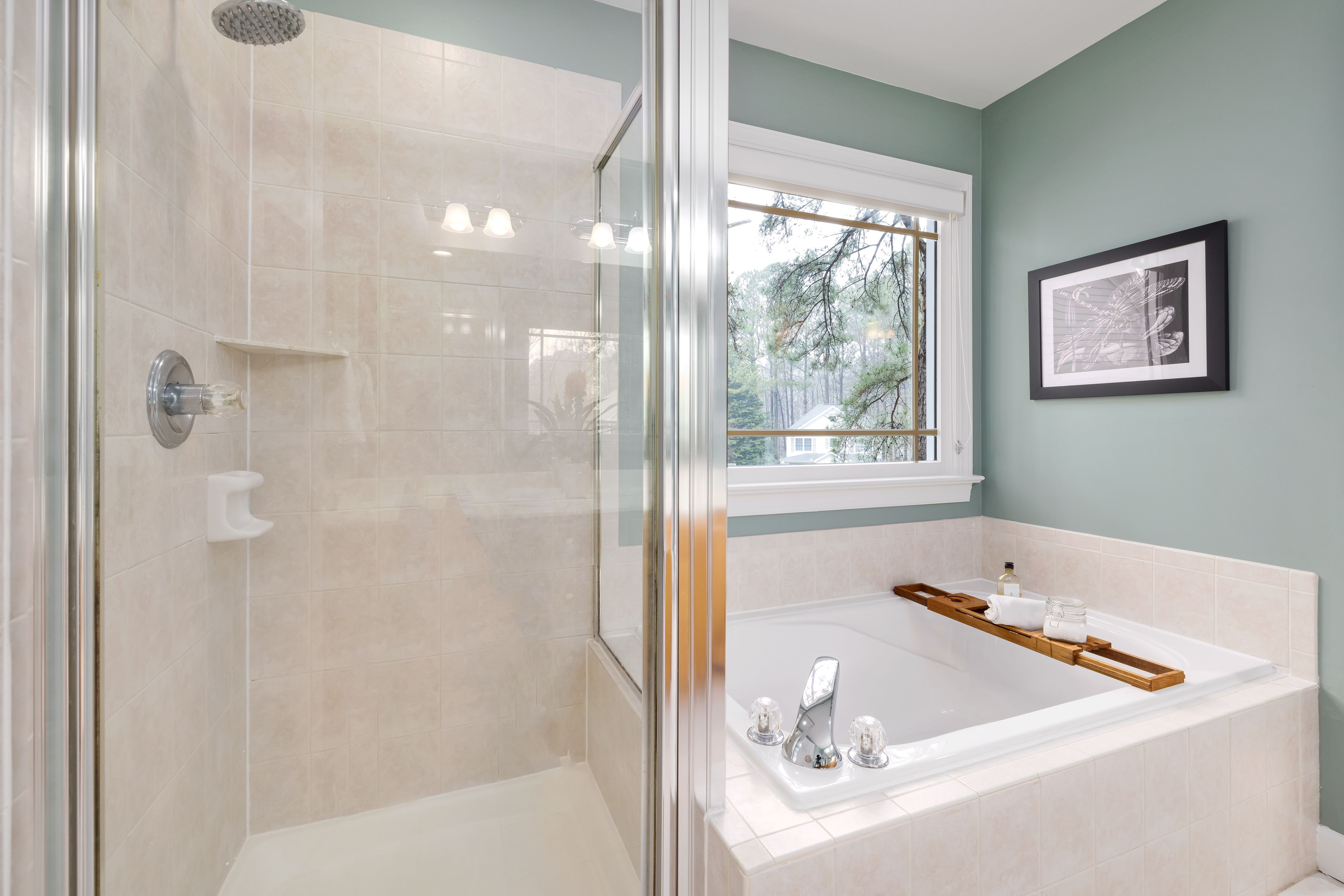 A Bathroom with a Bath Tub and Shower Room · Free Stock Photo