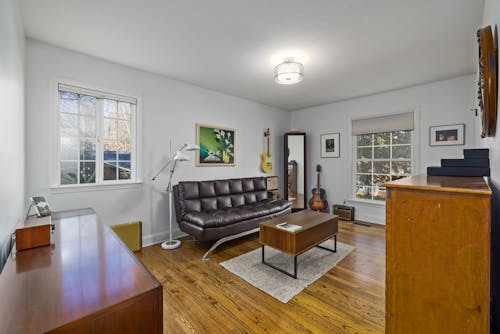 Brown Sofa Bed and Coffee Table on a Wooden Floor