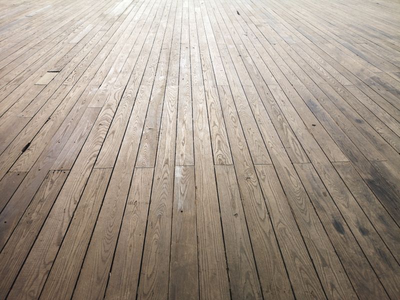 Consistent Light Flooring Throughout Connected Rooms