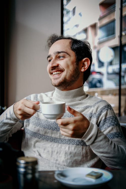 Man in a Cafe Smiling 