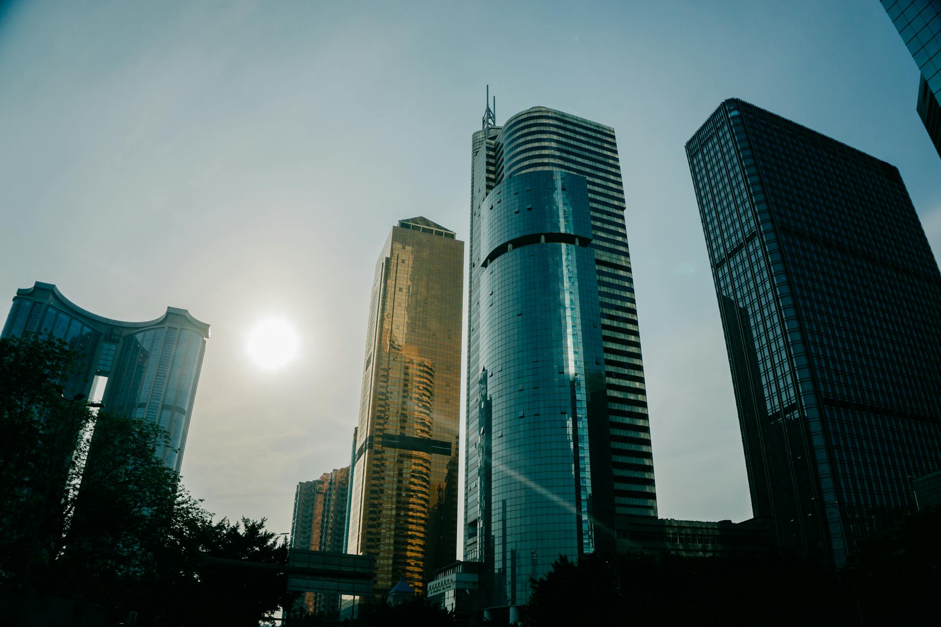 A stunning low-angle view of modern skyscrapers in Guangzhou, China with a beautiful sky.