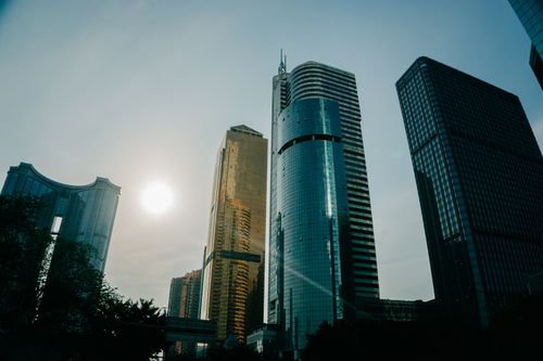 Free A stunning low-angle view of modern skyscrapers in Guangzhou, China with a beautiful sky. Stock Photo