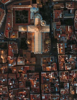 Stunning aerial shot of Tarragona's historic buildings and urban layout at sunrise.
