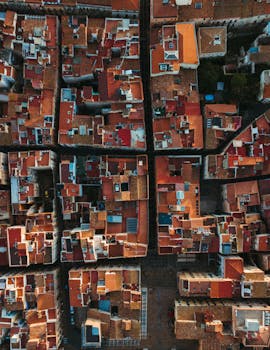 A stunning aerial photograph of the colorful historic rooftops in Tarragona, Spain.