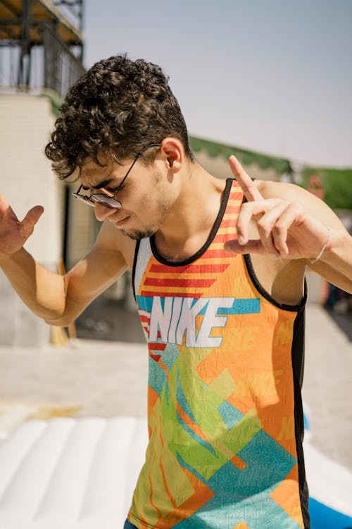 A Man in a Tank Top Posing