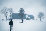 2 Person Walking on Snow Covered Ground