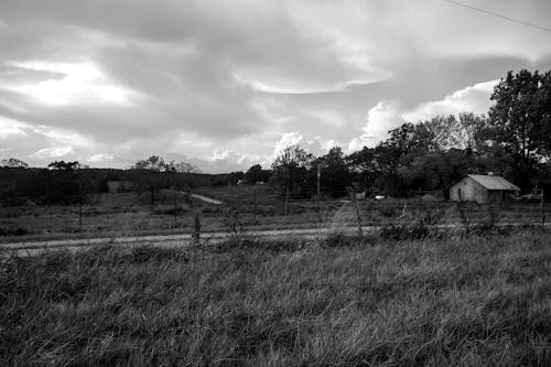 Free stock photo of barn, black and white, clouds