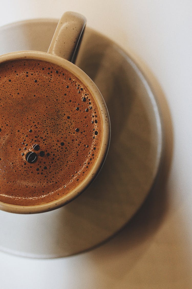 A Cup Of Coffee With Bubbles