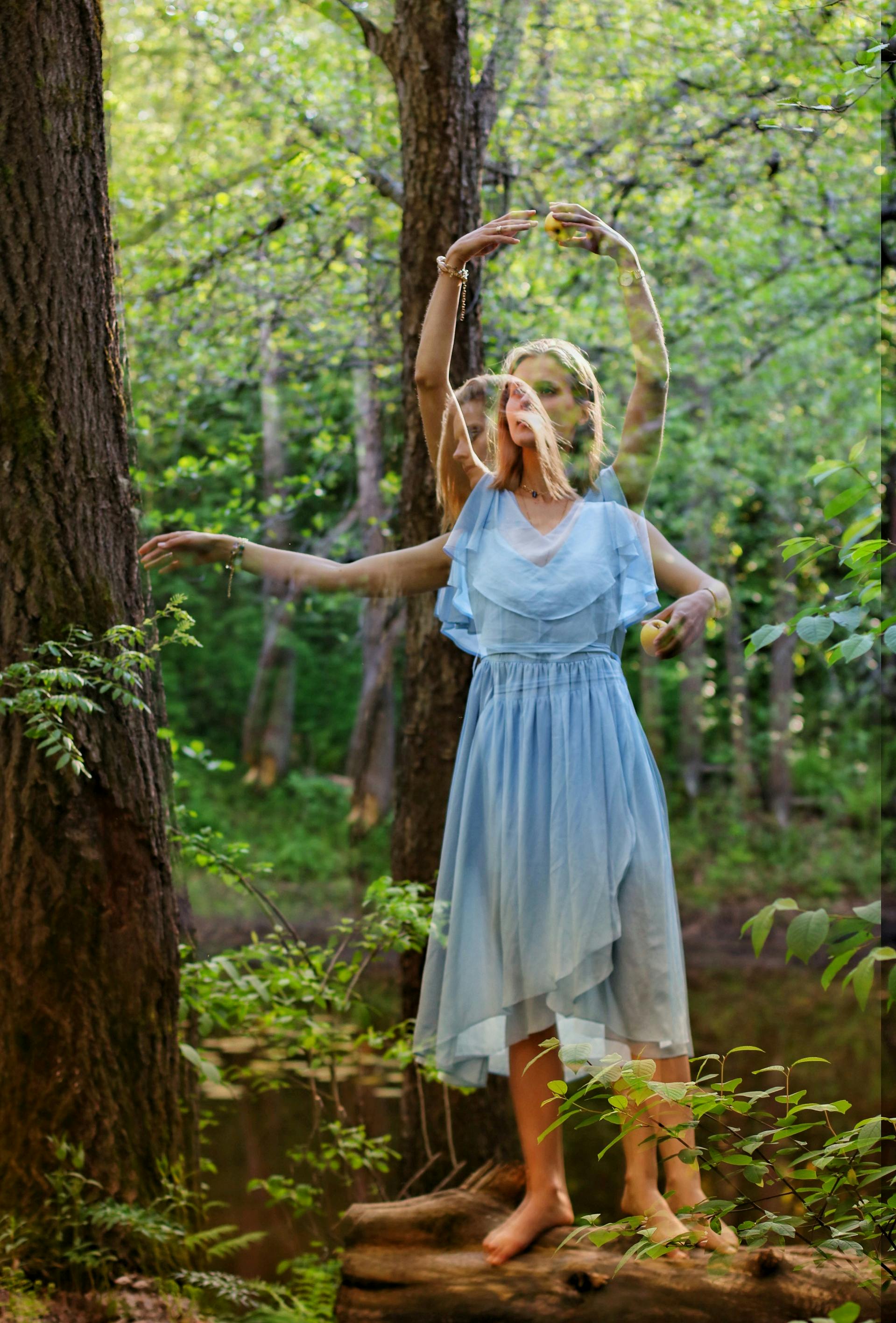 A serene scene of a woman dancing barefoot in a mystical forest, captured with a double exposure effect.