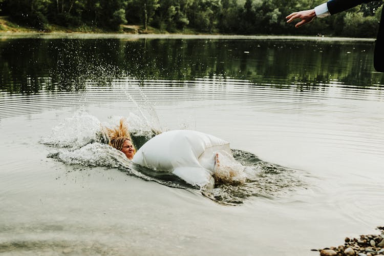 Woman In White Dress Falling On Water