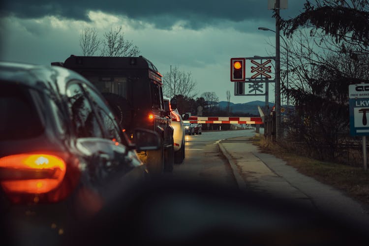 Cars Waiting In Line At Level Crossing