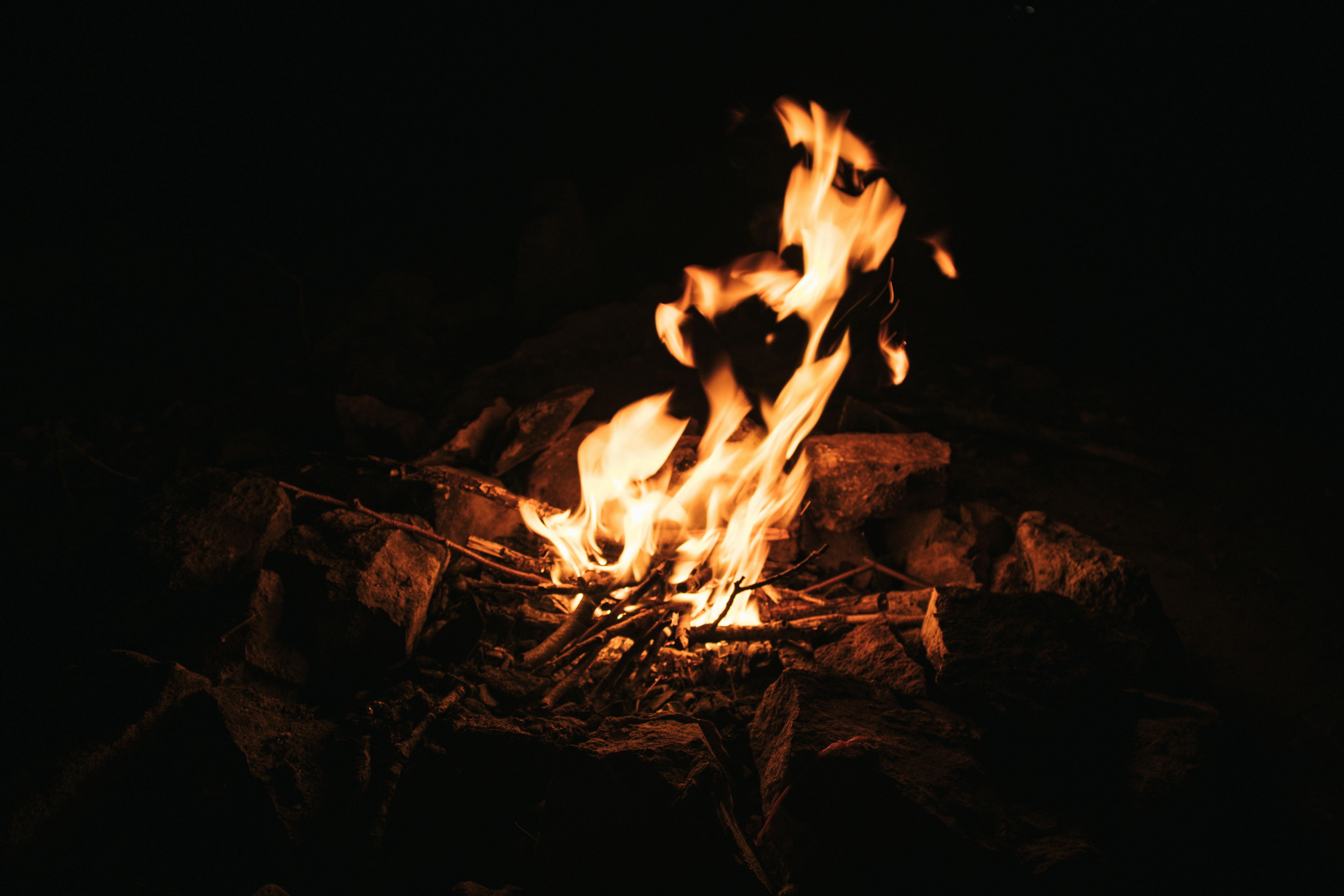 Silhouette of a Person Behind a Bonfire · Free Stock Photo