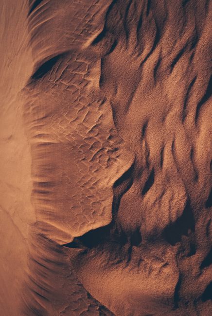 Beautiful aerial shot of textured sand dunes in El Abiodh Sidi Cheikh, Algeria.