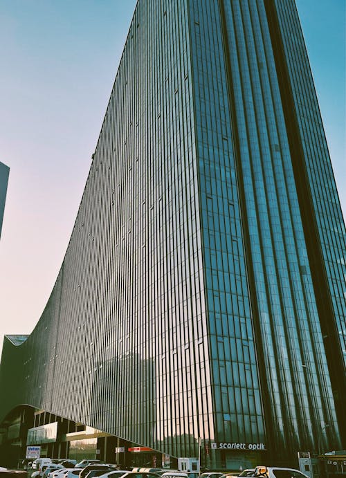 A Low Angle Shot of a Building with Glass Windows