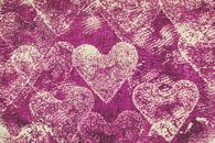 Patterned hearts on a textured purple background, ideal for Valentine's themes