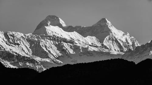 Grayscale Photo of Snow Covered Mountain