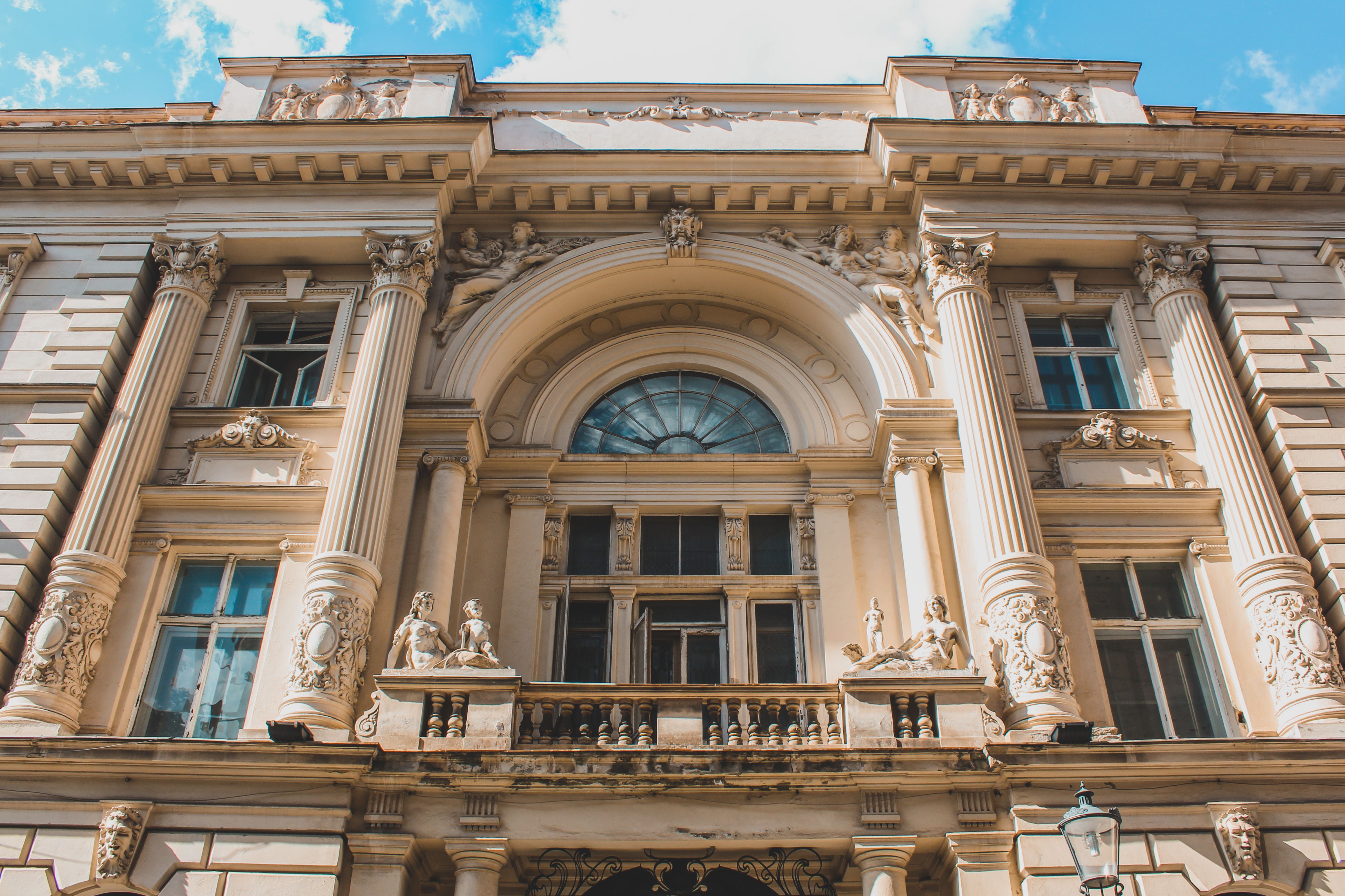 A group on a free walking tour exploring the historic streets of Bucharest Old Town, Romania