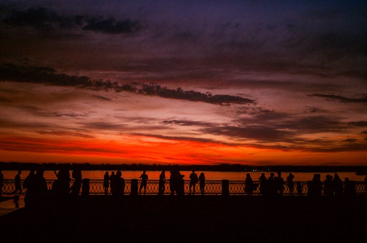 Silhouette Of People On The Beach During Sunset