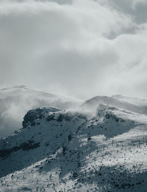 Free Breathtaking view of snow-covered mountains under a cloudy sky in Turkey, showcasing winter's beauty. Stock Photo