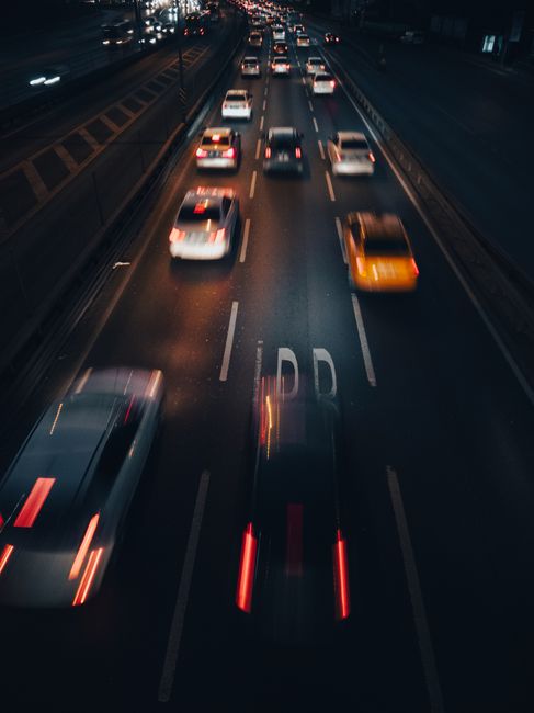 Dynamic long exposure of nighttime traffic on a bustling Istanbul road.